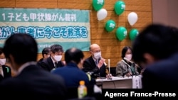 Kenichi Ido (C), lawyer and head attorney for six young people who were living in the Fukushima region when the March 11, 2011 tsunami caused the nuclear disaster, speaks during a press conference in Tokyo on Jan. 27, 2022. 