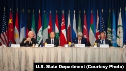 From left, U.N. Special Envoy for Syria Staffan de Mistura, U.N. Secretary-General Ban Ki-moon, U.S. Secretary of State John Kerry and Russian Foreign Minister Sergei Lavrov lead a meeting on a plan for establishing a transitional government in Syria, in 