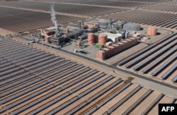 FILE —An aerial view of the solar mirrors at the Noor 1 Concentrated Solar Power (CSP) plant, some 20Km (12.5 miles) outside the central Moroccan town of Ouarzazate on February 4, 2016.