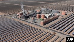 FILE - An aerial view of the solar mirrors at the Noor 1 Concentrated Solar Power plant, 20Km (12.5 miles) outside the central Moroccan town of Ouarzazate on February 4, 2016. Morocco plans to become a top player in creating "green hydrogen," made without burning fossil fuels.