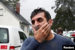Mosque board member Irfan Mushtaq reacts after a shooting in al-Noor Islamic center mosque, near Oslo, Norway, Aug. 10, 2019.