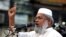FILE - Bangladesh Minister for Social Welfare Ali Ahsan Mojaheed addresses a protest rally organized by the Jamat -e-Islami Party in Dhaka, April 21, 2006.