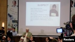 FILE - A slide showing a picture of Imran Ali, who was sentenced to death for the rape and murder of seven-year-old Zainab Ansari, is shown at a press conference in Lahore, Pakistan January 23, 2018.