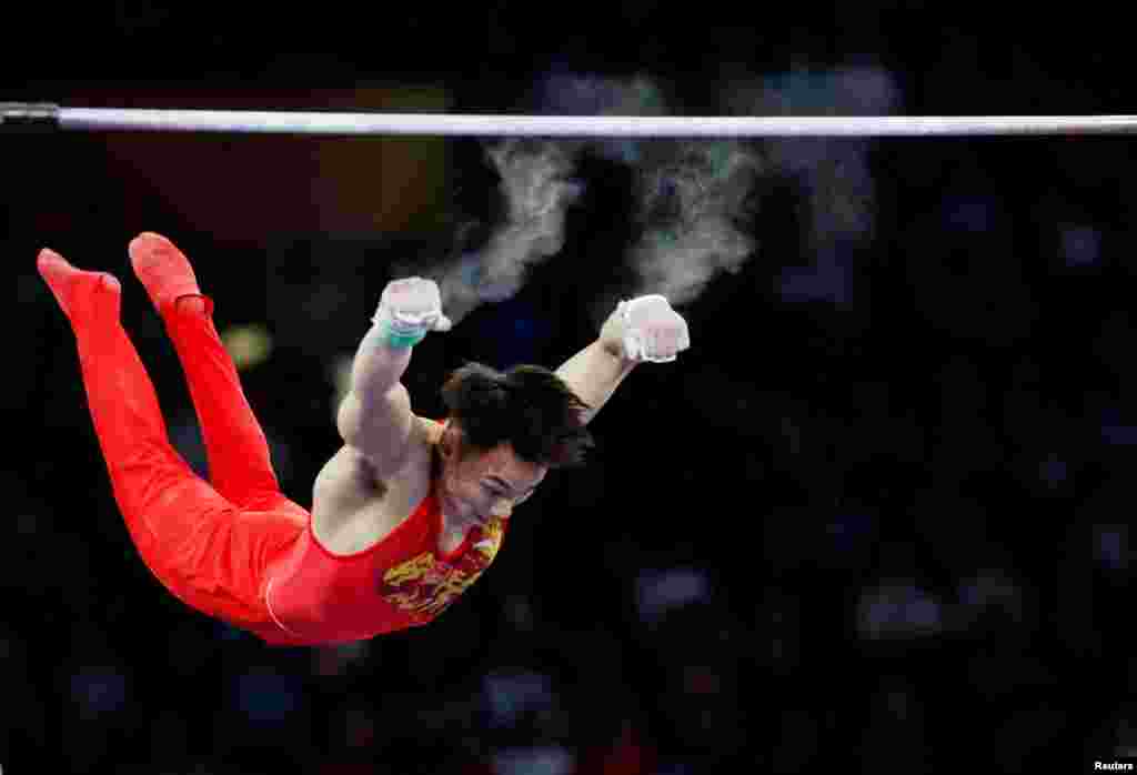 China&#39;s Sun Wei performs on the horizontal bar during the men’s team final at the FIG Artistic Gymnastics World Championships at the Hanns-Martin-Schleyer-Halle in Stuttgart, Germany.