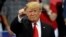 President Donald Trump points during a campaign rally, Oct. 31, 2018, in Estero, Fla.