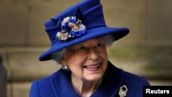 FILE - Britain's Queen Elizabeth leaves after a Service of Thanksgiving to mark the Centenary of the Royal British Legion at Westminster Abbey, London, Oct. 12, 2021.