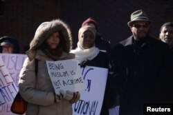 FILE - Muslims and their supporters participate in a rally for Muslim rights outside of the James A. Byrne Federal Courthouse in Philadelphia, Jan. 13, 2015.