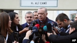 FILE - Turkey's President Recep Tayyip Erdogan speaks to the media in Istanbul, Turkey, Jan. 17, 2020.