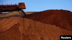 Major mining companies like Rio Tinto, unloading iron ore in Australia in December, 2013, will learn the true extent of Cameroon's resources after a World Bank-funded aerial survey of one of Africa's mineral-rich nations. 