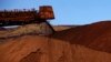 Major mining companies like Rio Tinto, unloading iron ore in Australiaa in December, 2013, will learn the true extent of Cameroon's resources after a World Bank-funded aerial survey of one of Africa's mineral-rich nation's. 