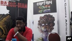 Bill Masuku, a Zimbabwean comic book artist and writer, sits at a stall at Comic Con Africa, a three-day comic book and pop culture convention in Johannesburg, South Africa, Sept. 15, 2018. The success of Marvel's "Black Panther" film spiked interest in African stories, and creators on the continent hope to capitalize with more comic book characters of their own. The three-day convention ending Sunday in South Africa was a platform for their efforts, even if it was dominated by the global superheroes, villains and other pop culture figures who have been around for decades. 