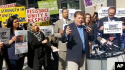 Artemio Arreola, an organizer with the Illinois Coalition for Immigrant and Refugee Rights, speaks to other advocates in downtown Chicago, April 24, 2017. 