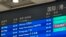 The cancelled status of an Air Koryo flight from North Korea's capital Pyongyang is seen in red on an information board at Beijing Capital international airport on August 21, 2023.