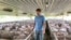 FILE - US farmer Matthew Keller walks through one of his pig barns near Kenyon, Minn. 