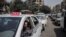 FILE - A taxi driver waits in line for fuel at a gas station in Cairo's neighboring city of Giza, Egypt, Sept. 4, 2014. Egypt's parliament approved a law to govern popular ride-hailing apps Uber and Careem, which had faced legal challenges. 
