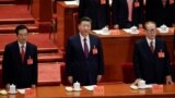 Former presidents Jiang Zemin and Hu Jintao sing the national anthem next to China's President Xi Jinping during the opening of the 19th National Congress of the Communist Party of China at the Great Hall of the People in Beijing, China October 18, 2017. 