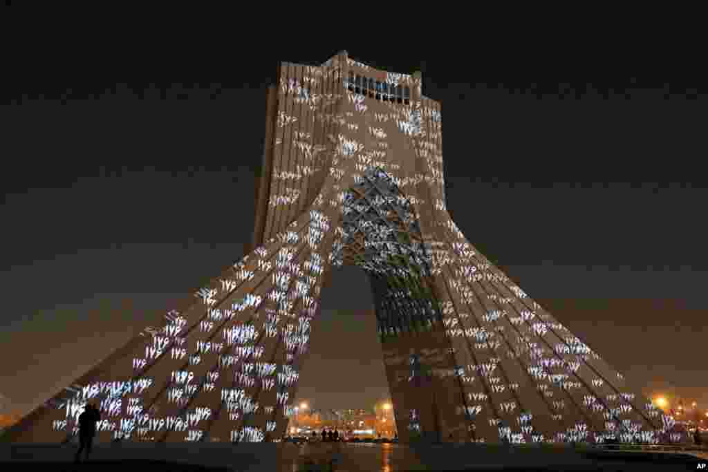 The video mapping is projected on Tehran&#39;s iconic Azadi(freedom) tower to commemorate 176 victims of the Ukrainian flight during a municipal memorial marking the first anniversary of the plane crash, in Tehran, Iran.