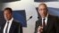 European Central Bank (ECB) executive board member Joerg Asmussen (R) addresses reporters next to Greece's Finance Minister Yannis Stournaras during a news conference in Athens, Greece, Aug. 21, 2013. 