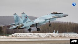 This handout picture provided by the Russian defense corporation Rostec on Nov. 24, 2023 shows a Sukhoi Su-35S fighter jet at the grounds of an aviation firm in the far-eastern city of Komsomolsk-on-Amur.