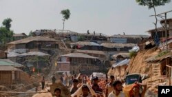 Rohingya refugees rebuild their makeshift houses, in preparation for the approaching monsoon season at the Kutupalong Rohingya refugee camp in Kutupalong, Bangladesh, April 28, 2018.