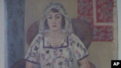 FILE - A Nov. 5, 2013, photo shows a painting by Henri Matisse, “Woman Sitting in an Armchair,” projected onto a screen.