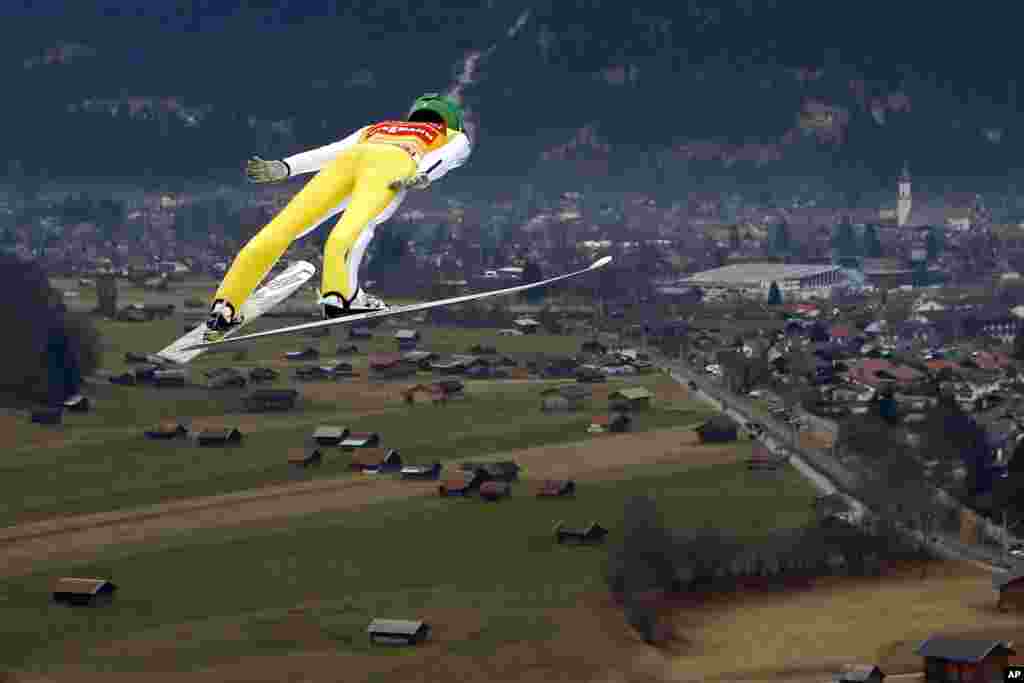 Slovenia&#39;s Peter Prevc soars through the air during his trial jump at the second stage of the 64th four hills ski jumping tournament in Garmisch-Partenkirchen, Germany.