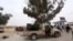 Fighters loyal to Libya's internationally recognized government are seen after taking control of Watiya airbase, southwest of Tripoli, May 18, 2020.