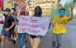 FILE - Demonstrators protest against the visit of Cambodian Prime Minister Hun Sen in Yangon, Myanmar, Jan. 7, 2022, in this screen grab obtained by Reuters from a video.