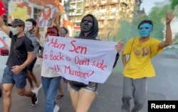 FILE - Demonstrators protest against the visit of Cambodian Prime Minister Hun Sen in Yangon, Myanmar, Jan. 7, 2022, in this screen grab obtained by Reuters from a video.