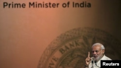 FILE - India's Prime Minister Narendra Modi speaks during an event on financial inclusion in Mumbai, April 2, 2015. Modi will arrive in Tehran Sunday for talks with Iranian President Hassan Rouhani.