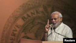 FILE - India's Prime Minister Narendra Modi speaks during an event on financial inclusion in Mumbai, April 2, 2015. 