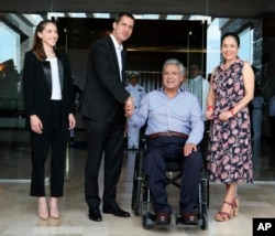 Ecuador's President Lenin Moreno, center right, and his wife, Rocio Gonzalez, right, welcome Venezuela's self-declared interim president Juan Guaido, center left, and his wife, Fabiana Rosales, during a meeting in Salinas, Ecuador, March 2, 2019.