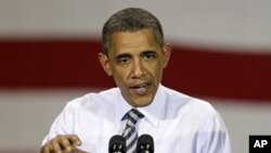 President Barack Obama speaks to workers at the Alcoa Davenport Works factory in Bettendorf, Iowa, June 28, 2011