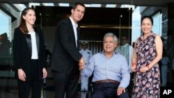 Ecuador's President Lenin Moreno, center right, and his wife, Rocio Gonzalez, right, welcome Venezuela's self-declared interim president Juan Guaido, center left, and his wife, Fabiana Rosales, during a meeting in Salinas, Ecuador, March 2, 2019.