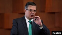 FILE - Mexico's Foreign Minister Marcelo Ebrard addresses the audience after signing an agreement in Mexico City, April 8, 2019. 