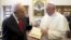 Pope Francis, right, receives a Jerusalem Bible as a gift from Israeli President Shimon Peres on the occasion of their private audience, at the Vatican, April 30, 2013. 