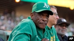 FILE - Former Oakland Athletics player Rickey Henderson looks on before a baseball game between the Athletics and the Texas Rangers in Oakland, Calif., Sept. 25, 2024. 