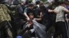 Migrants Rush Past Police into Macedonia