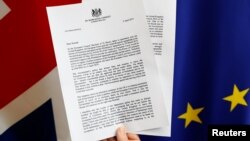 A copy of a letter from Britain's Prime Minister Theresa May, to European Council President, Donald Tusk, regarding Brexit is seen in this picture illustration at the EU Council, April 5, 2019.