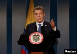 Colombia's President Juan Manuel Santos talks during a news conference after a meeting with former Colombian President Alvaro Uribe at Narino Palace in Bogota, Colombia, Oct. 5, 2016.