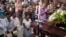 People pray by the coffin of slain Janeth Urquia, an environmentalist and indigenous rights activist, during Mass in Marcala, Honduras, July 8, 2016.