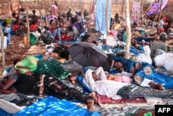 Ethiopian refugees who fled fighting in Tigray province lay in a hut at the Um Rakuba camp in Sudan's eastern Gedaref province, Nov. 16, 2020.