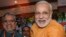 Chief Minister of India’s western state of Gujarat Narendra Modi, right, stands with Bihar state Deputy Chief Minister Sushil Modi, June 9, 2013.