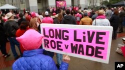 Pat Thompson displayed a sign supporting Roe v. Wade at a rally, held by Planned Parenthood, commemorating the 45th anniversary of the landmark Supreme Court decision at the Capitol, Jan. 22, 2018, in Sacramento, California. 