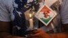 FILE - An Indian man holds a candle as he participates in a demonstration in support of Indian naval officer Kulbhushan Jadhav in Mumbai, India, June 03, 2017.