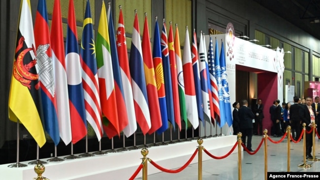 FILE - Member country flags of the Association of Southeast Asian Nations (ASEAN) are displayed at the group's summit in Bangkok, Thailand, Nov. 4, 2019.