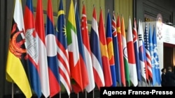 FILE - Member country flags of the Association of Southeast Asian Nations (ASEAN) are displayed at the group's summit in Bangkok, Thailand, Nov. 4, 2019. 