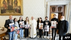 FILE— This photo taken and handout on April 8, 2024 by The Vatican Media shows Pope Francis during a meeting with relatives of Israeli hostages from the Bibas family, Omri Miran, Agam Berger, Guy Gilboa Dalal and Tamir Nimrodi, held in Gaza since October 7 by Hamas militants.