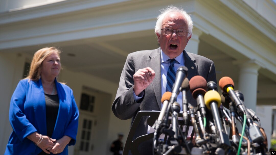Democratic presidential candidate Sen. Bernie Sanders, I-Vt., accompanied by his wife Jane Sanders, speaks to reporters outside the White House in Washington, June 9, 2016, following a meeting with President Barack Obama.