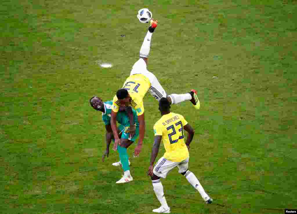 Colombia&#39;s Yerry Mina jumps for the ball during the group H match between Senegal and Colombia, at the 2018 soccer World Cup in the Samara Arena in Samara, Russia.